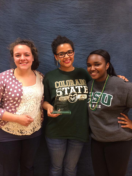 3 students posing with GAIA award