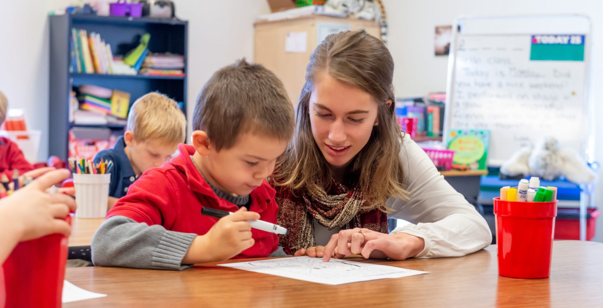 Teaching to learn, learning to teach: CSU students volunteering at local language school receive as much as they give