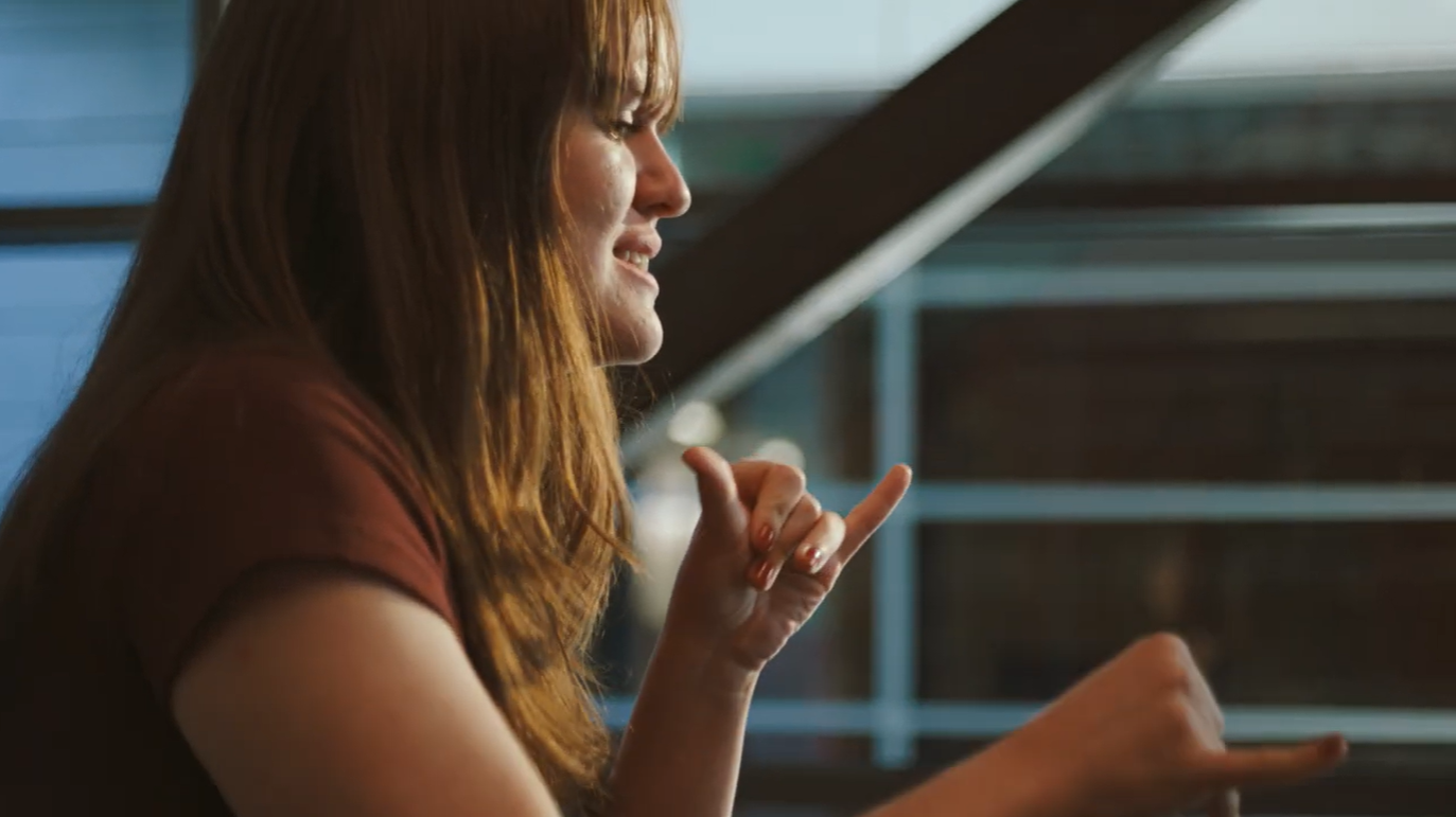 Student signing in American Sign Language