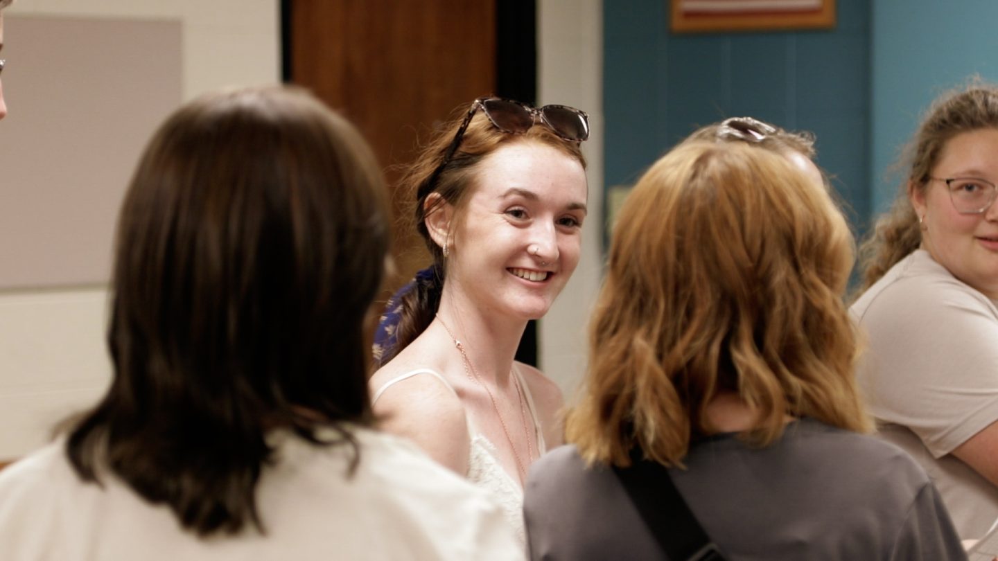 Student in class smiling