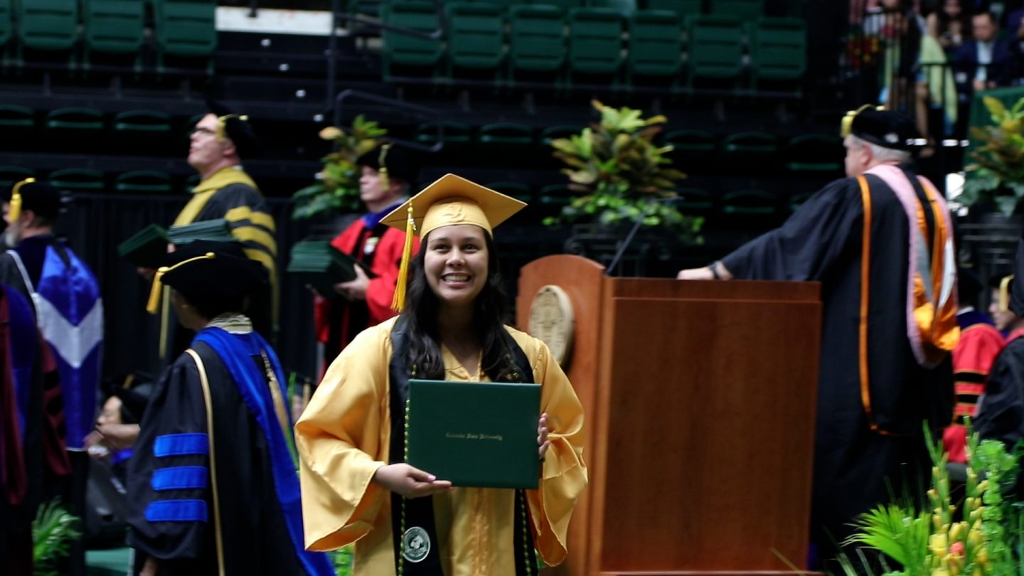Languages student smiling at graduation